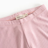 Pink leggings with elastic waistband and visible brand logo on the inside.