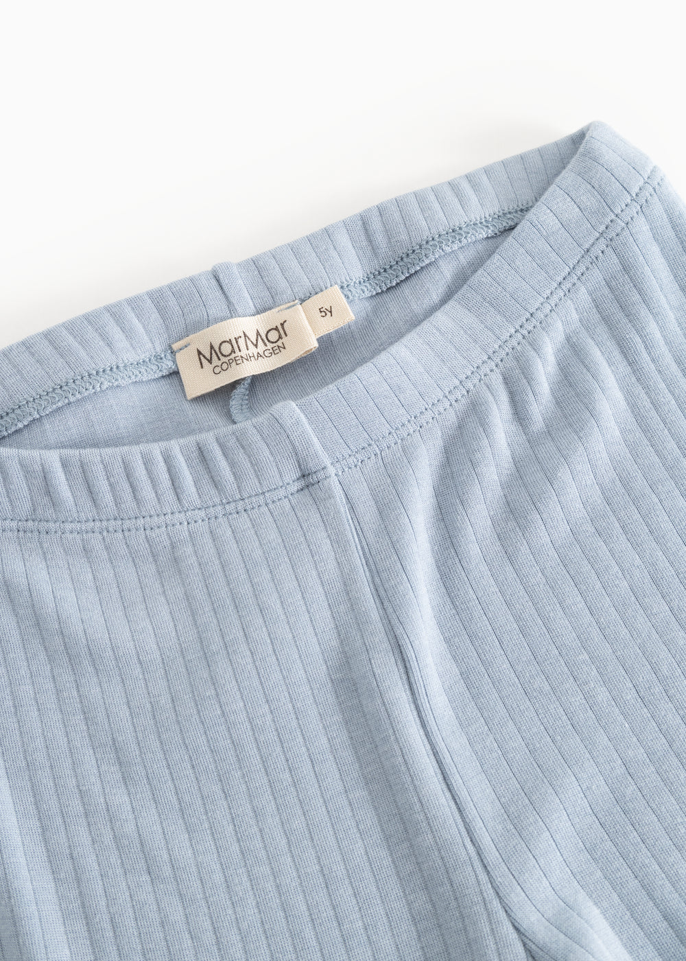 Light blue leggings with elastic waistband and ribbed seam detail.