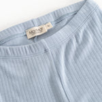 Light blue leggings with elastic waistband and ribbed seam detail.