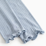 Light blue leggings with ribbed edge and fringe hem.