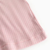 Pink evening dress: ribbed fabric and seam at the hem, visible edge finishing.