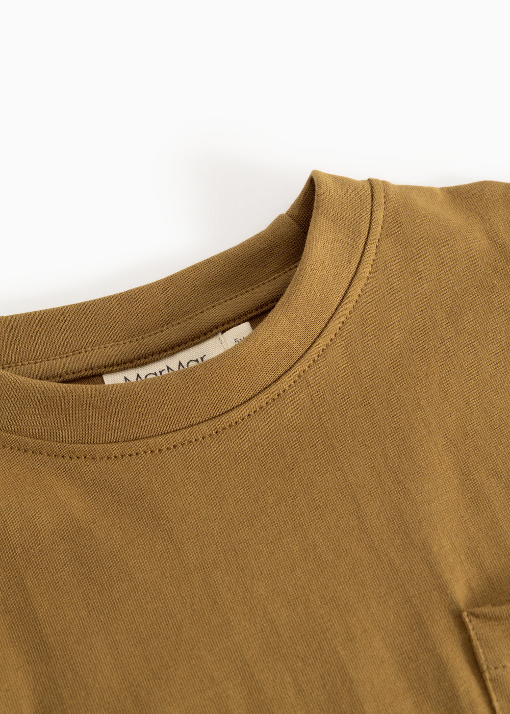 Caramel brown blouse with round neckline and visible seam at the collar