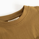 Caramel brown blouse with round neckline and visible seam at the collar