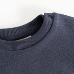 Round neckline with ribbed edge on dark navy blouse