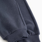 Inkblue pants legs with ribbed cuff at the ankle and side pocket.