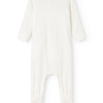 Baby ones in cream white with round neck and long legs at the back.