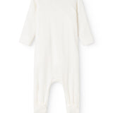 Baby ones in cream white with round neck and long legs at the back.