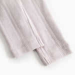 Baby pants in a light knitted texture with vertical stripes.