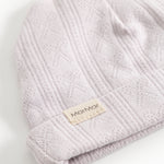 Aiko babyhue in light violet with diamond pattern and beige label on the edge