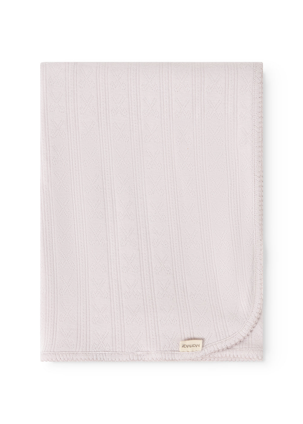 Bright little rug with woven pattern, smooth edge and small tag in the lower corner.