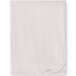 Bright little rug with woven pattern, smooth edge and small tag in the lower corner.