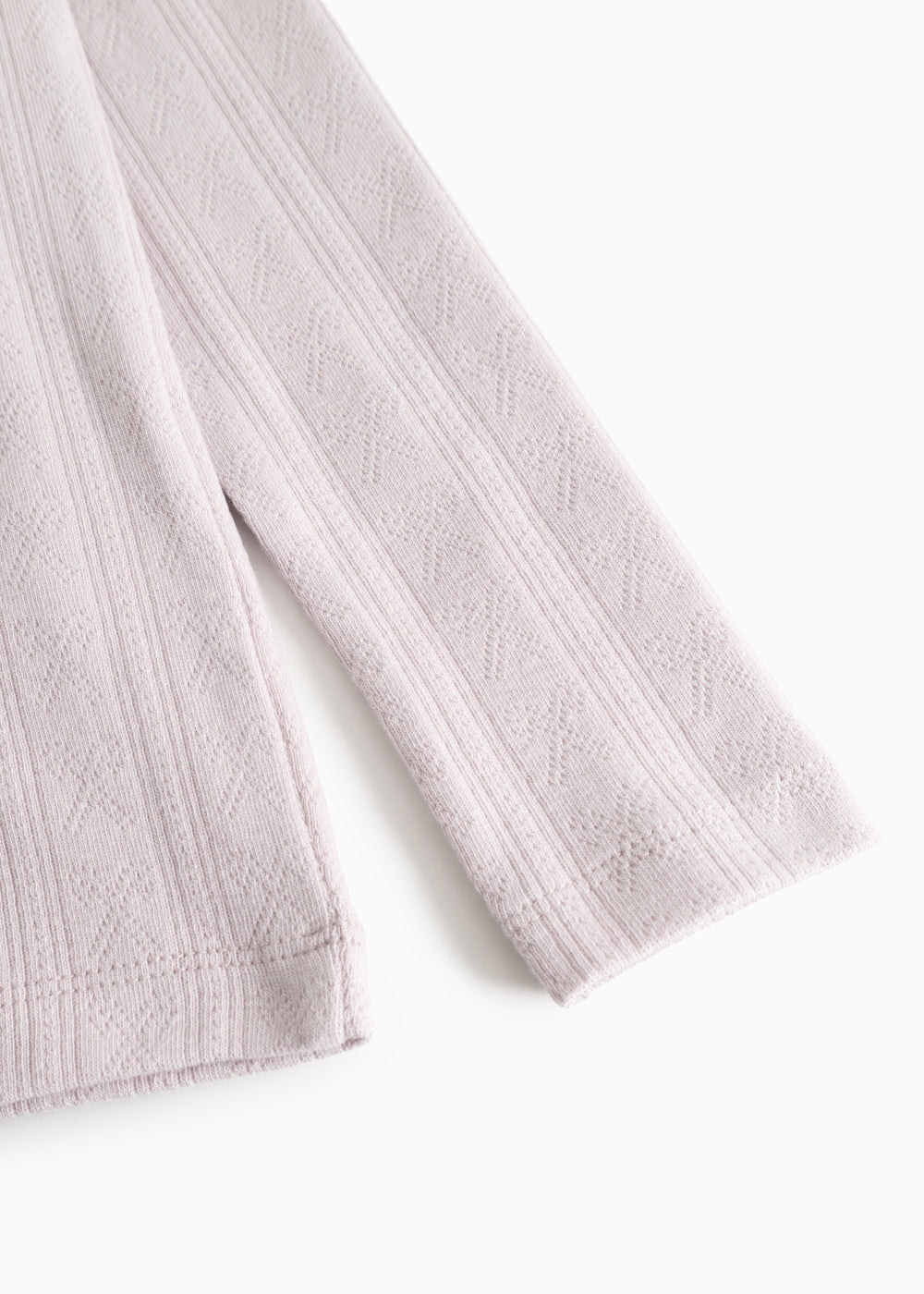 Sleeve children's T‑shirt in light purple with a nice textured pattern on the sleeve.