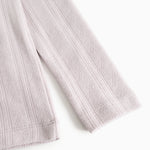 Sleeve children's T‑shirt in light purple with a nice textured pattern on the sleeve.