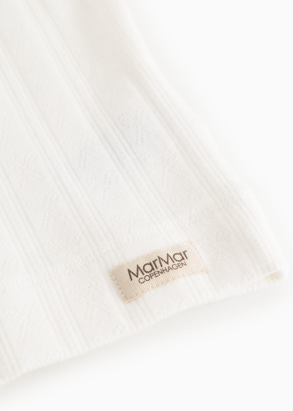White fabric with rib pattern and MarMar Copenhagen label on the underwear.