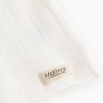 White fabric with rib pattern and MarMar Copenhagen label on the underwear.