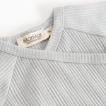 Light gray ribbed knit blouse with a V‑neck and a label at the back.