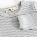 Sheer bodystocking in light gray-blue ribbing with a snap button closure at the neckline.