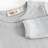 Sheer bodystocking in light gray-blue ribbing with a snap button closure at the neckline.
