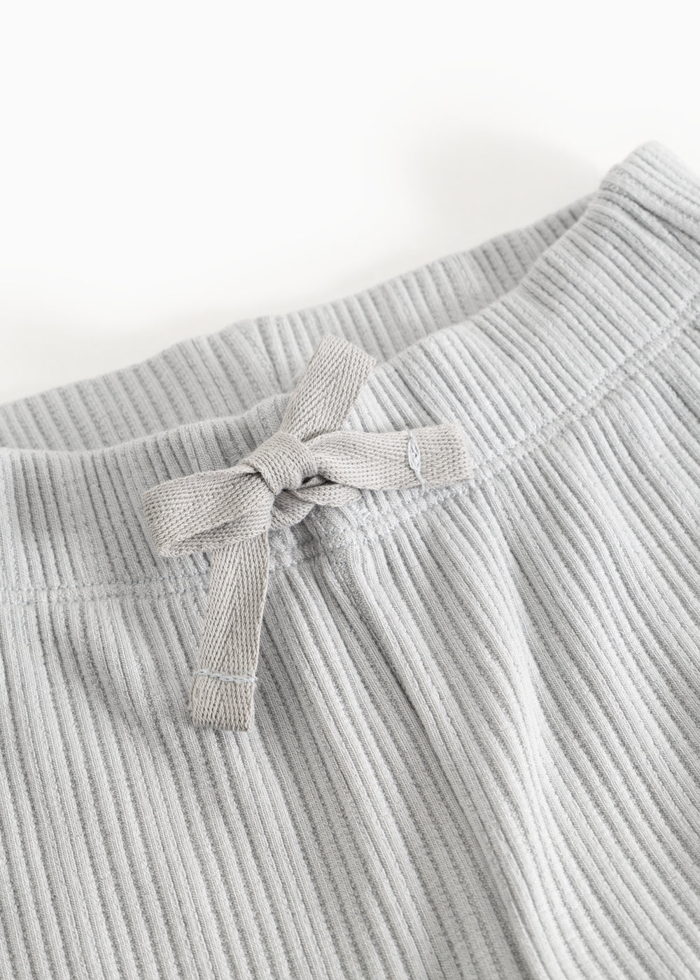 Baby tights with elastic waistband and front tie strap