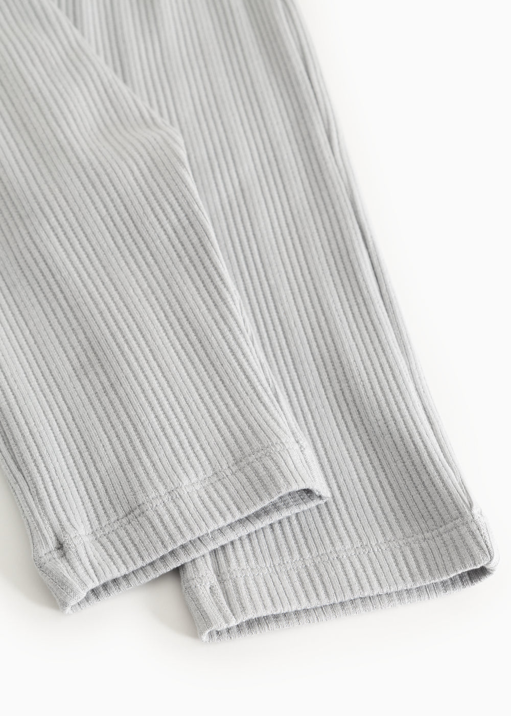 Baby pants with light blue stripes, ribbed edge at the bottom of the leg.