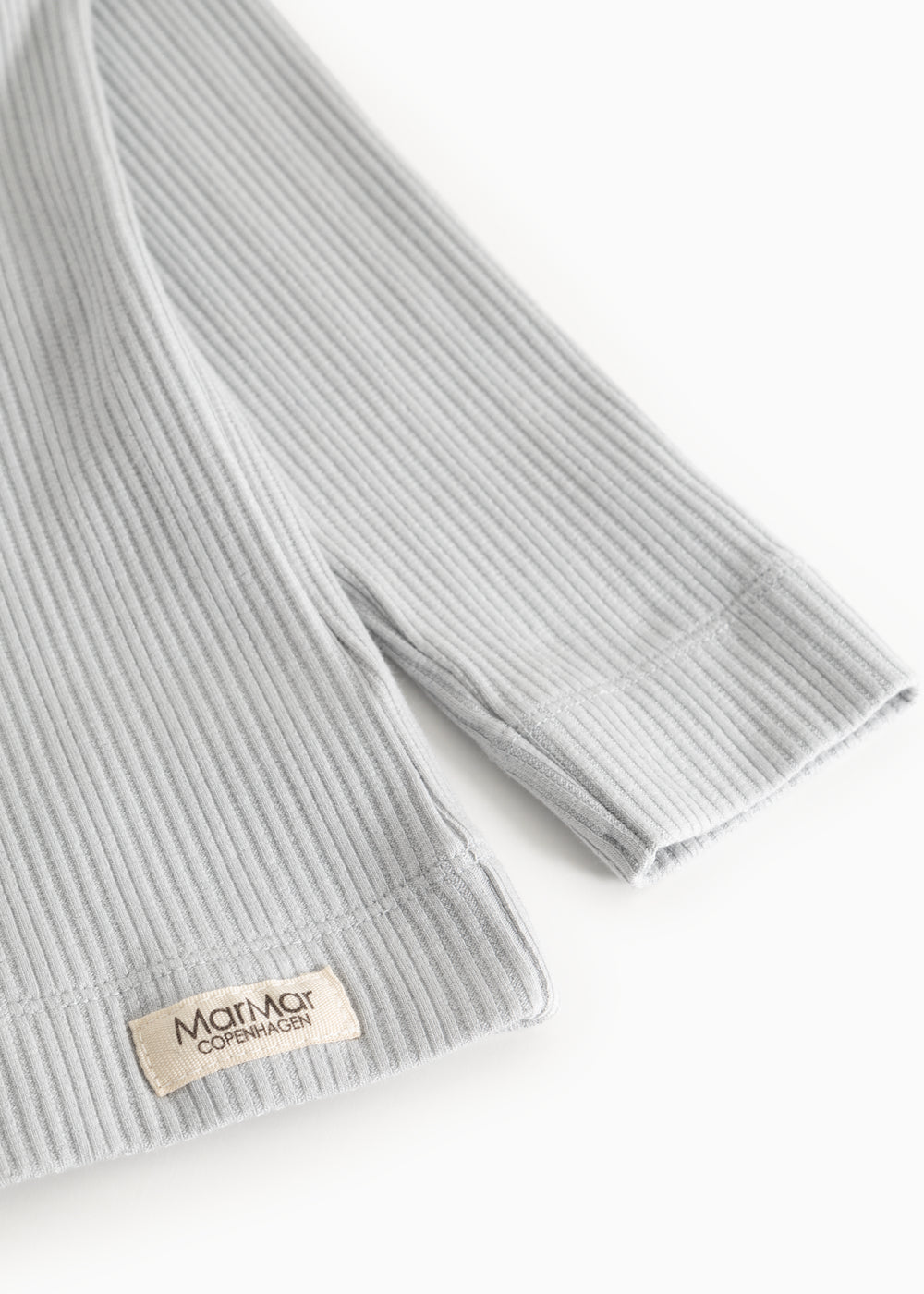 Light gray ribbed T-shirt with MarMar Copenhagen brand at the cuff.