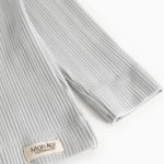 Light gray ribbed T-shirt with MarMar Copenhagen brand at the cuff.