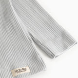 Light gray ribbed T-shirt with MarMar Copenhagen brand at the cuff.