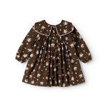 A dark brown dress with a round collar, front buttons, and a gathered floral print.