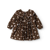 A dark brown dress with a round collar, front buttons, and a gathered floral print.