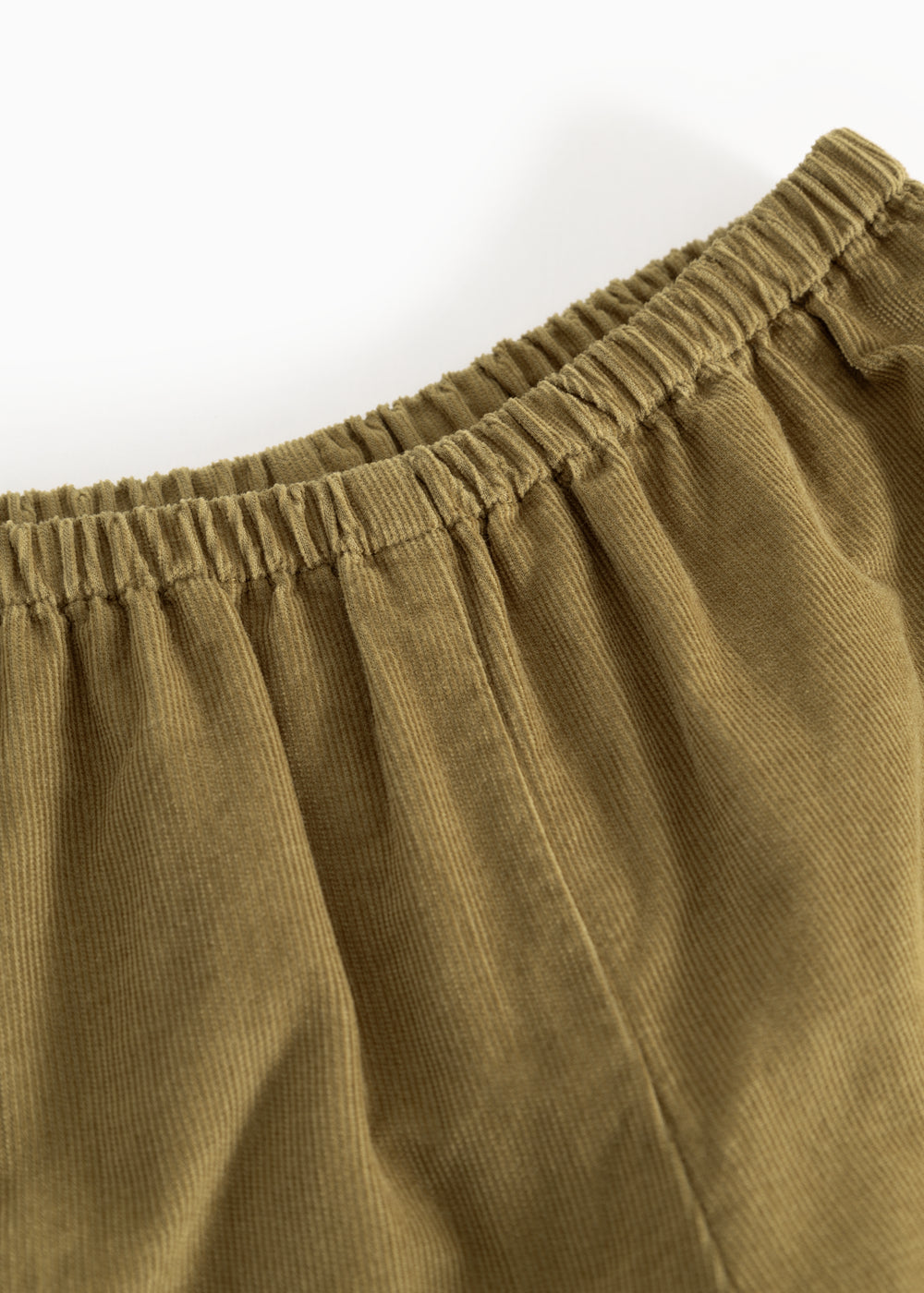 Dark bronze baby pants with elastic waist and pleated lining.