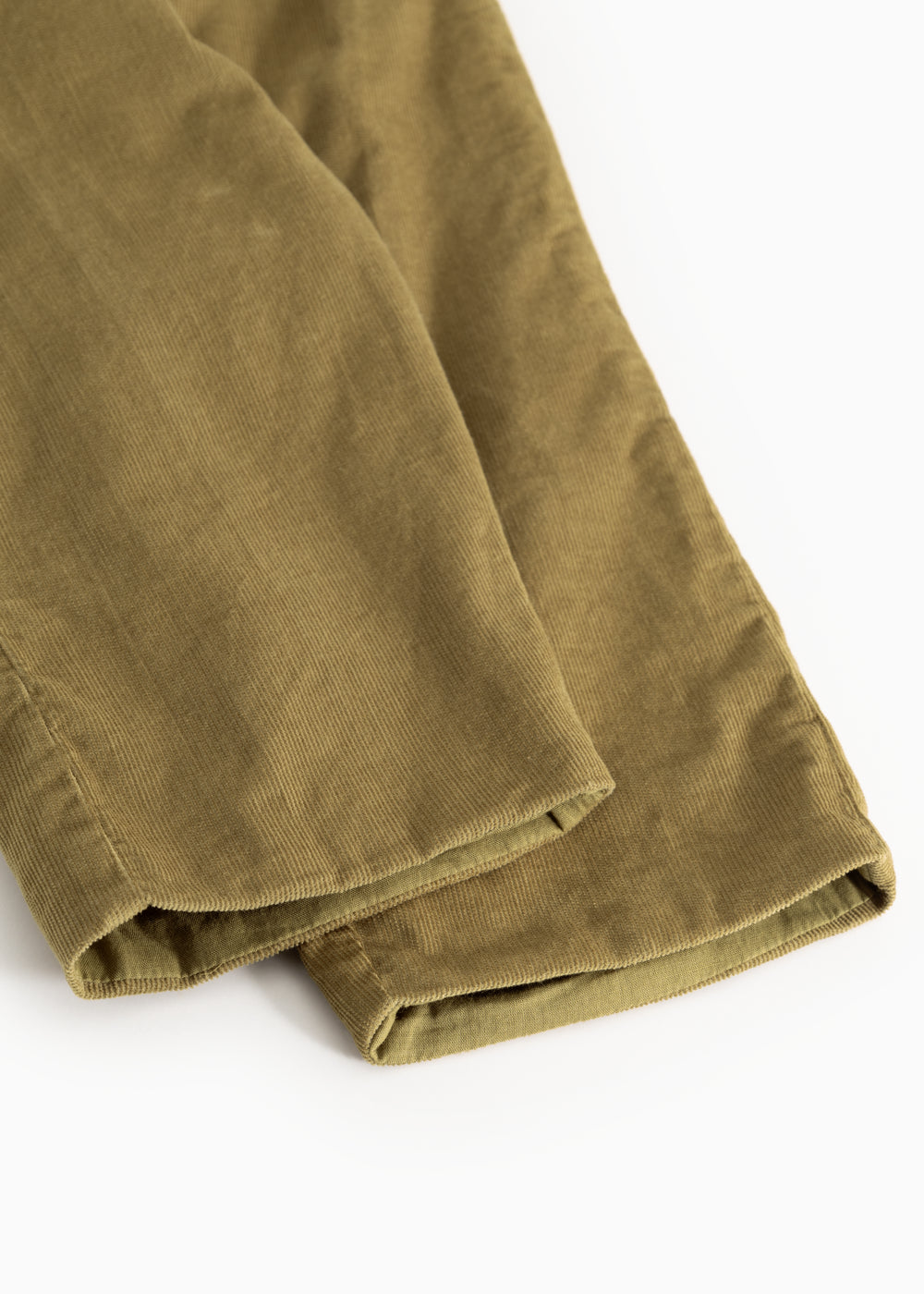 Dark bronze baby pants with ribbed edge at the bottom and visible seam.