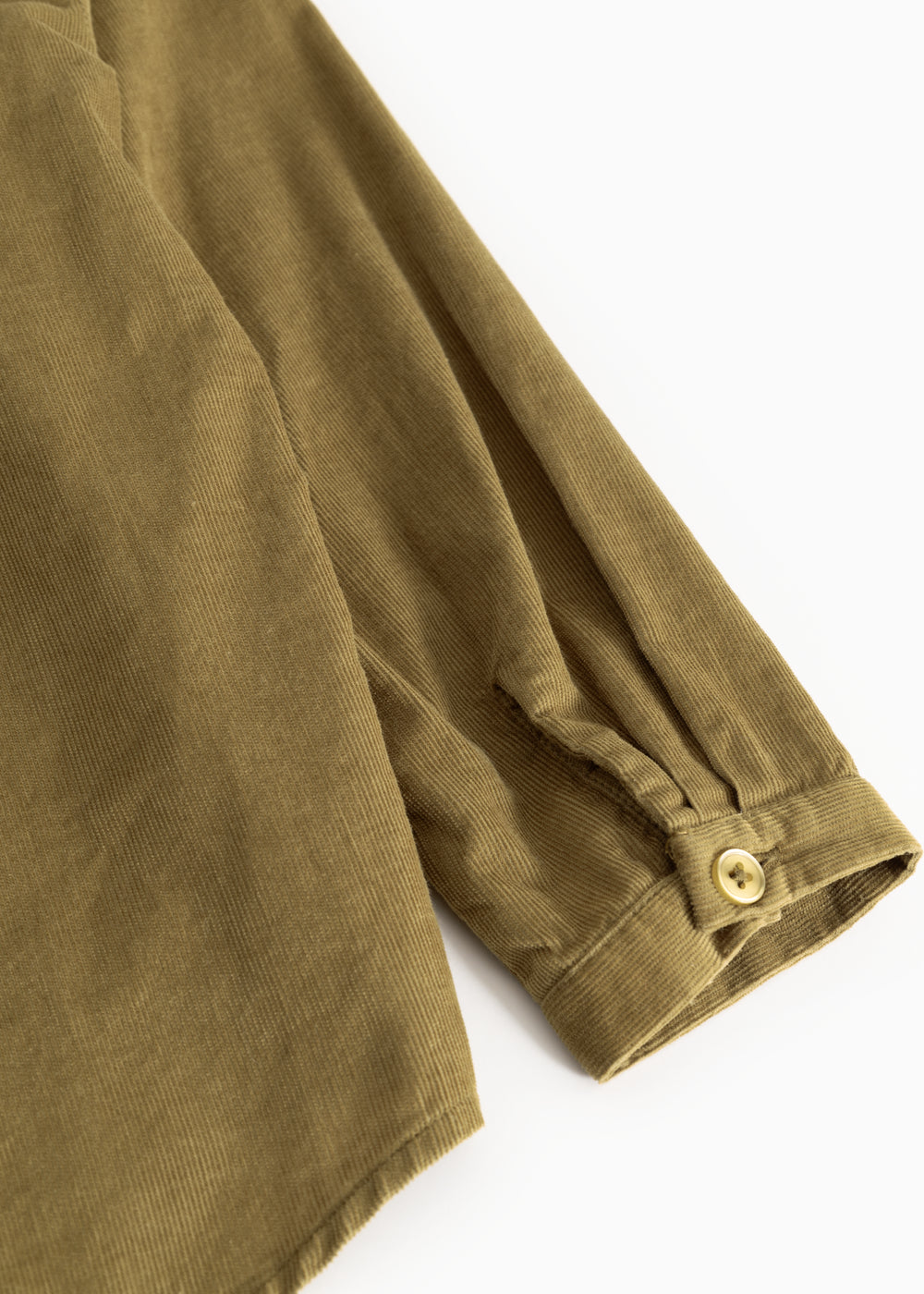 Kids shirt in dark bronze, long-sleeved with button cuffs and visible buttons.