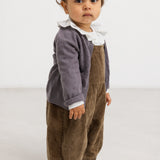 Riri B trousers in dark brown velvet rib with buttons on the waist straps