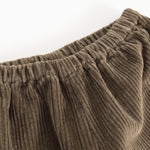 Baby bodysuits: tight cut of creased elastic lining in dark brown velvet.