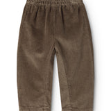 Baby bodysuits in dark brown velvet with elastic waistband and straight, loose legs.