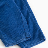 Dark blue baby pants with visible seam and ribbed edge at the bottom.