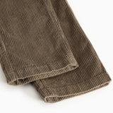 Brown corduroy pants with ribbed edge at the leg ending and seam.