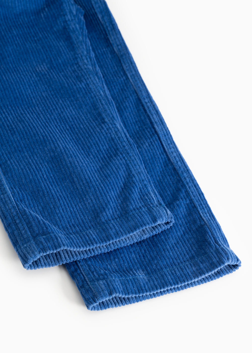 Blue velvet pants with a ribbed edge at the leg opening