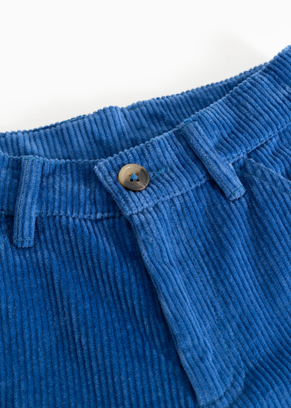 Blue corduroy trousers with elastic waistband and drawstring, featuring a button detail.