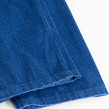 Blue corduroy trousers with visible ribbing and a raised edge at the hem.