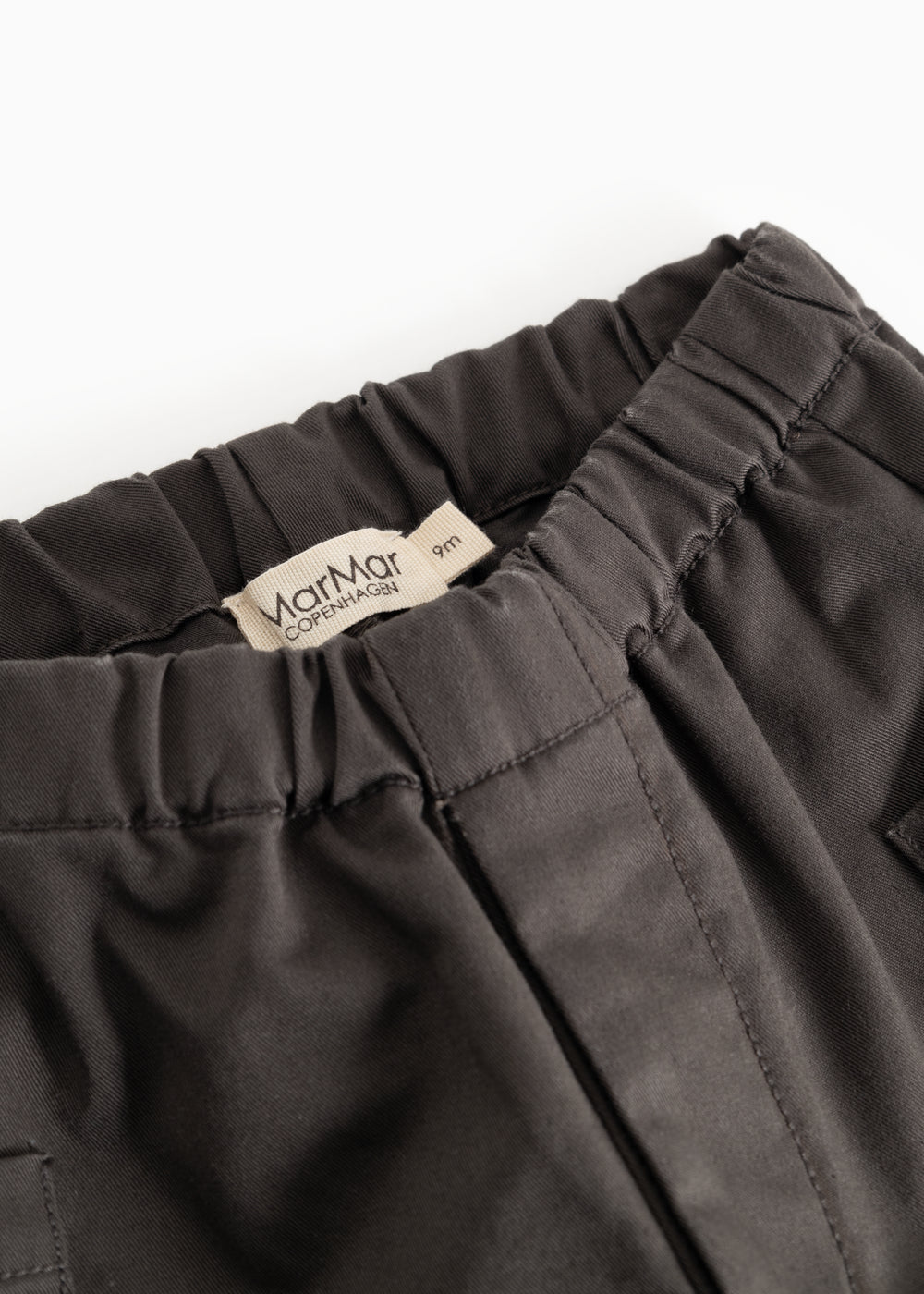 Leather Pants - Raven: elastic lining with drawstring, visible seam and label tag.