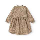 Beige baby dress with leopard print and ruched waist, long sleeves and A-line shape.