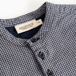 Short baby nets with a button pole and MarMar brand at the neck, dark dove blue checkered.
