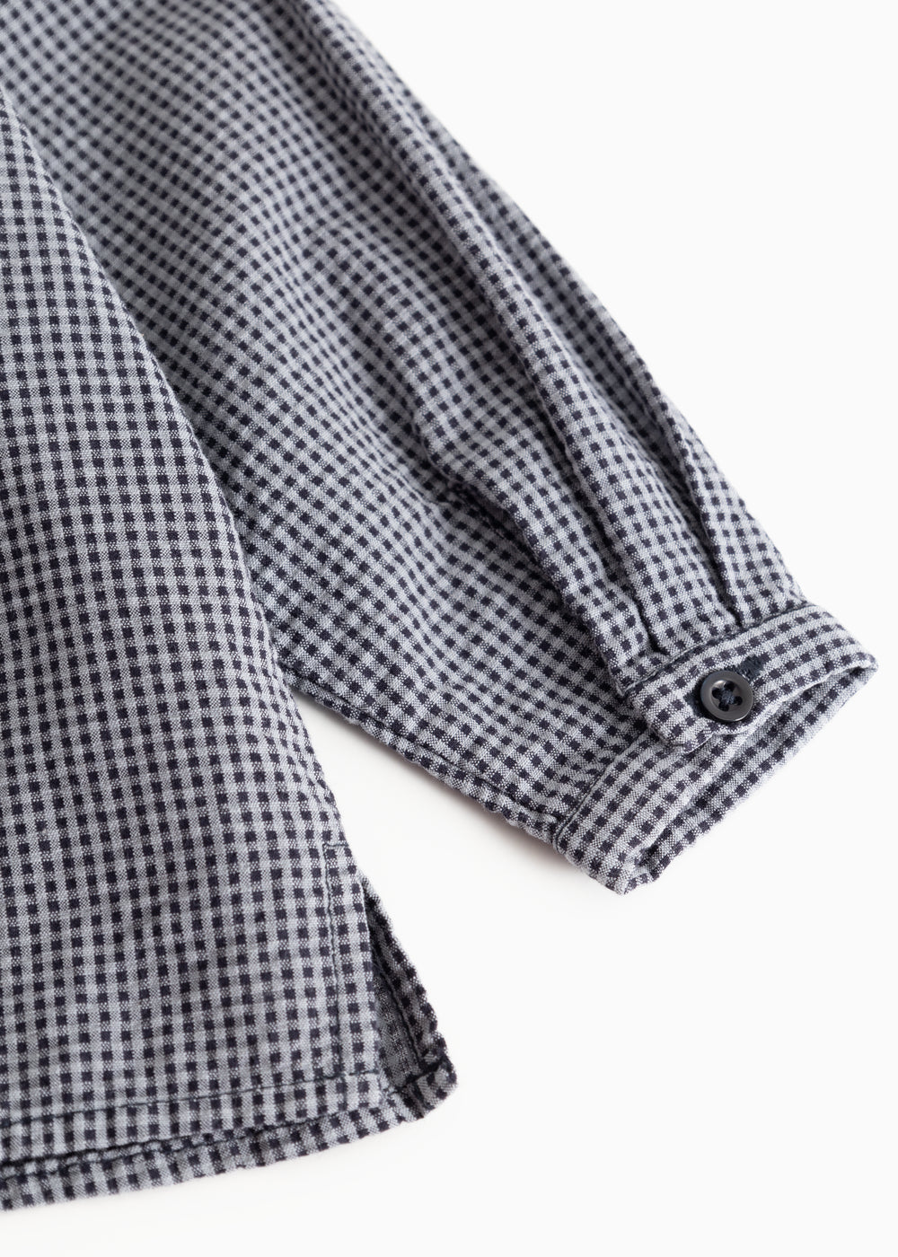 Striped shirt sleeve with cuff and buttons, dark navy blue checkered.