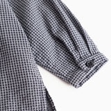 Striped shirt sleeve with cuff and buttons, dark navy blue checkered.