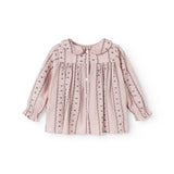 Pink baby blouse with pleated chest, button front and embroidered wave edges.