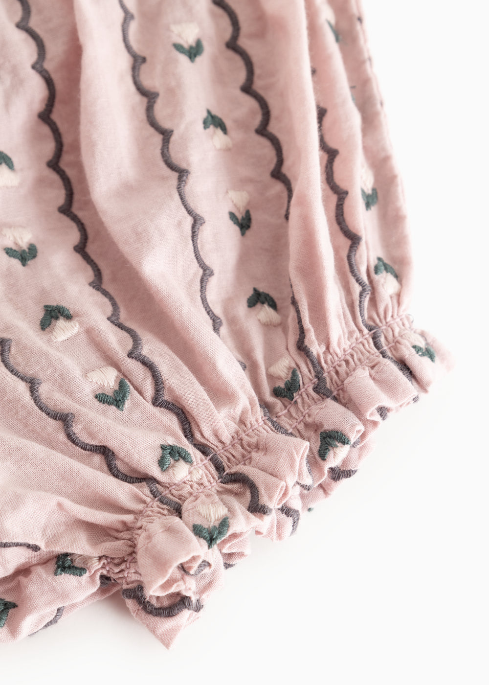 Dusty purple bloomers with patterned ribbons and ruffles at the leg openings.