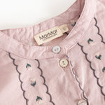 Dress the dust purple with front button closure and floral embroidery.