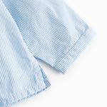 Light blue striped shirt with short sleeves and cuff trim.