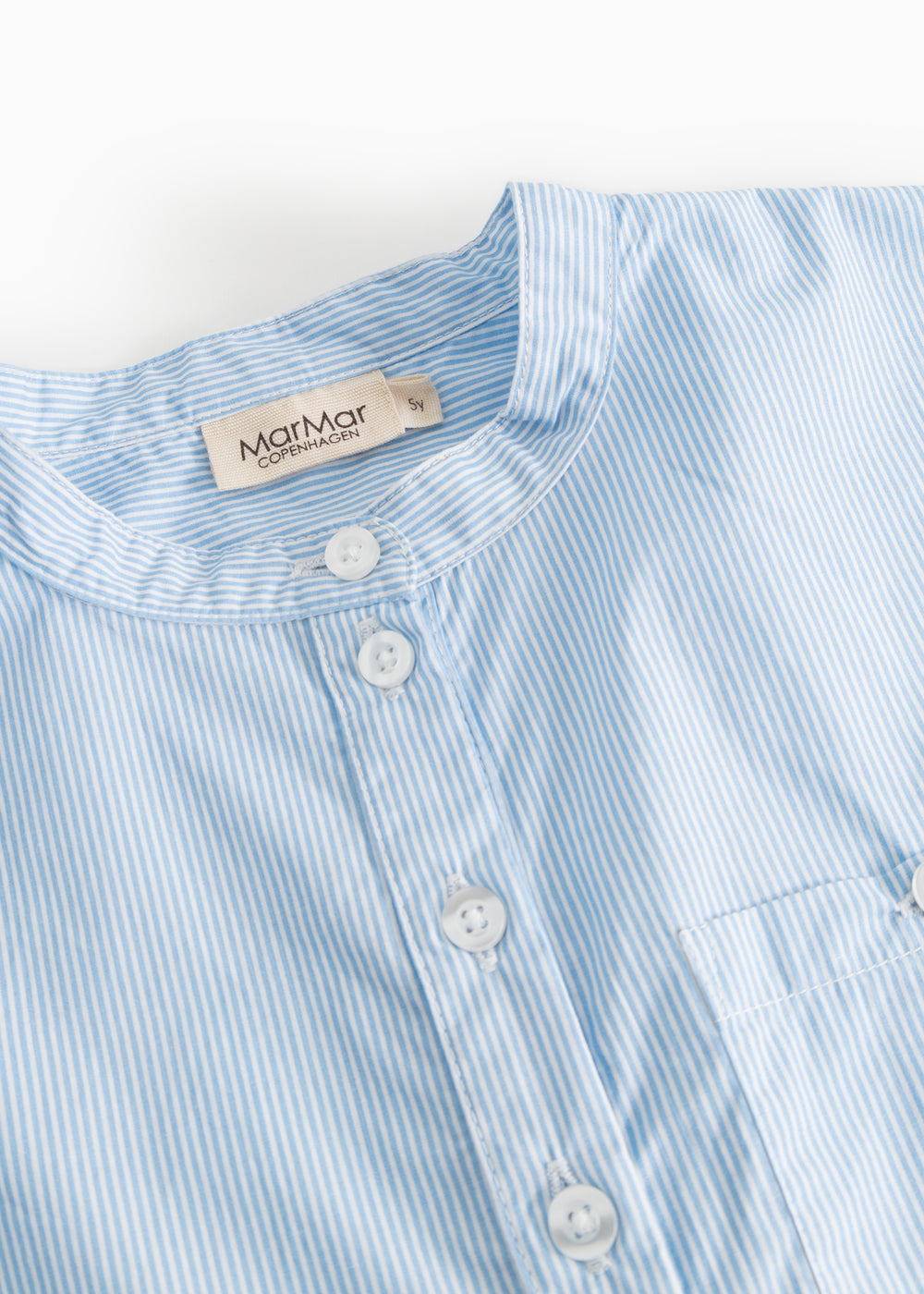 Light blue striped shirt with round neckline and three buttons.
